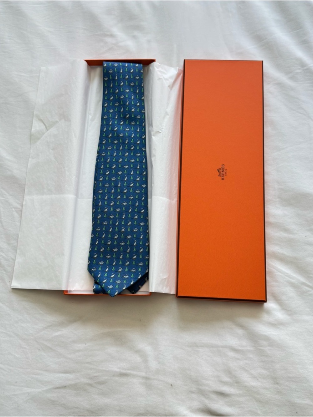 Hermes blue silk tie with skating penguin motif